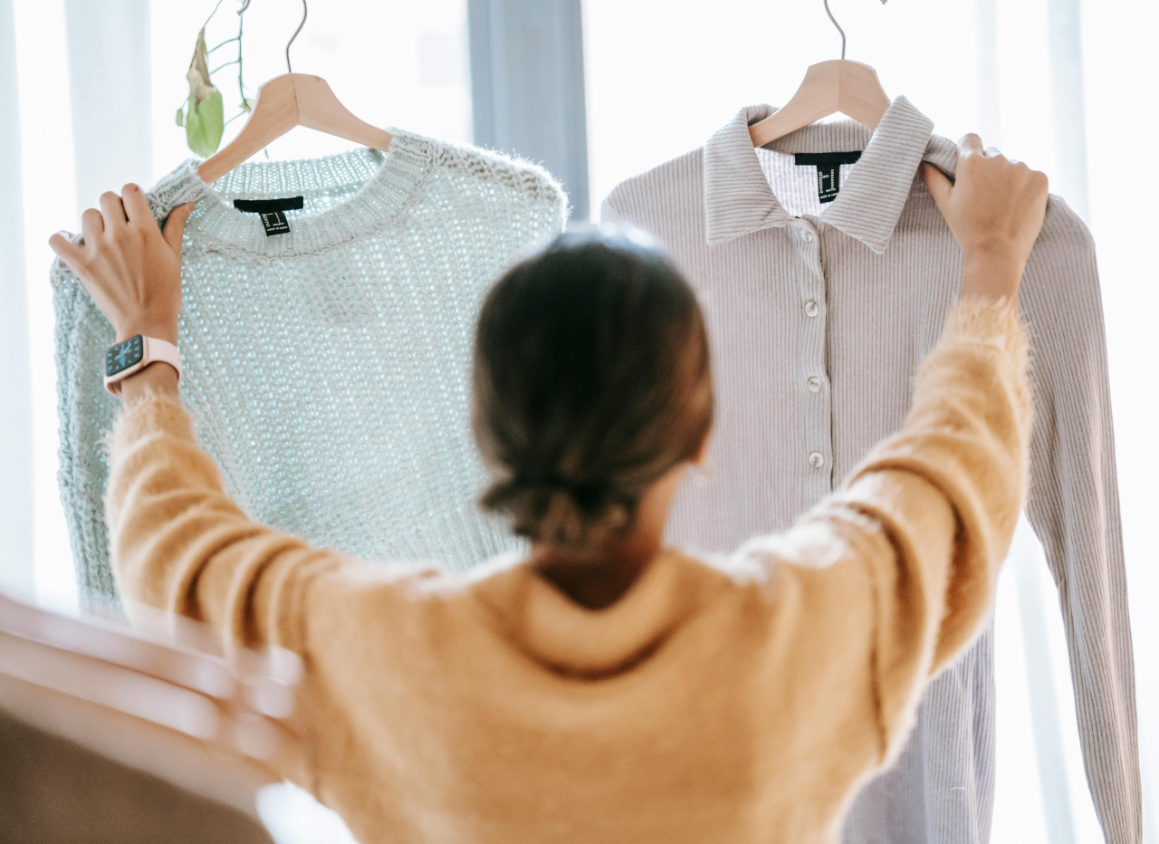 Person holding a clothing label