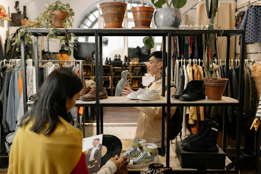 People shopping in a stylish secondhand fashion store